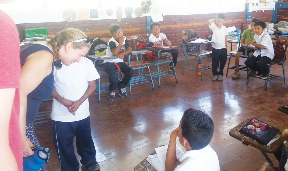 Mission Trip volunteers chat with students in a school in Nicaragua.