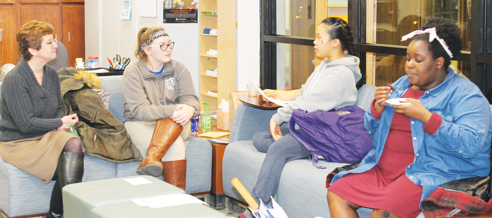 Director of TRIO Achievement Program Tammy Hove (‘93) and TRIO members chat and eat during TRIO day celebration.