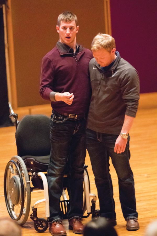 Chris+Norton+%28%2715%29+stands+up+on+stage+with+help+from+Alex+Peterson.