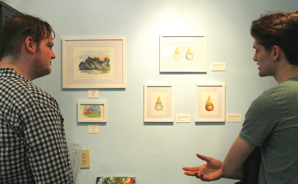 Matthew+Epsey+%28%E2%80%9819%29+and+Garret+Baumler+%28%E2%80%9820%29+enjoy+the+gnome+and+Nordic+landscape+pieces.%09%09%09+++++%09%09%09%09++++++