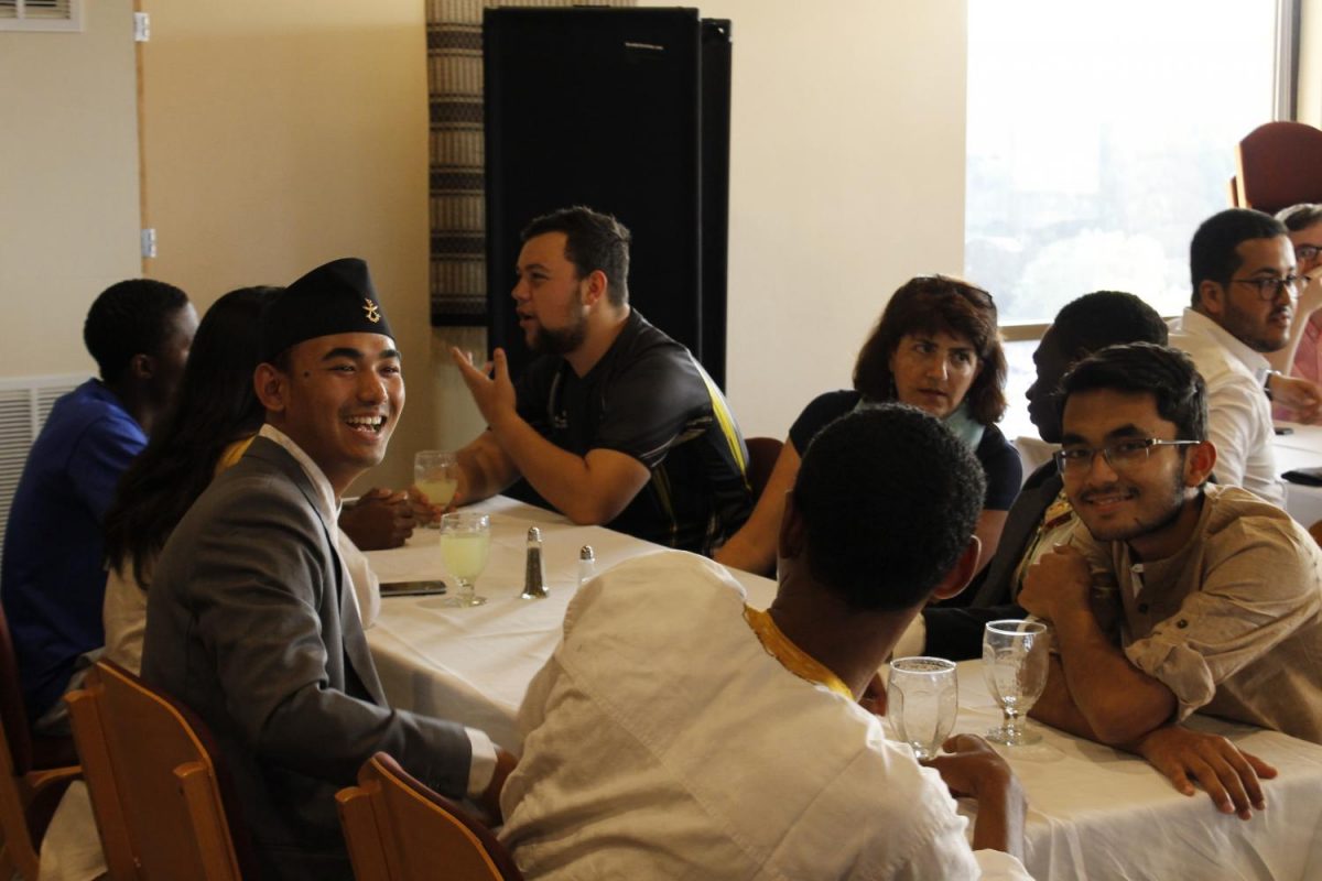 Yukesh+Mikchan+%28%E2%80%9821%29+holds+a+conversation+during+the+2017+International+Student+Welcome+Dinner.