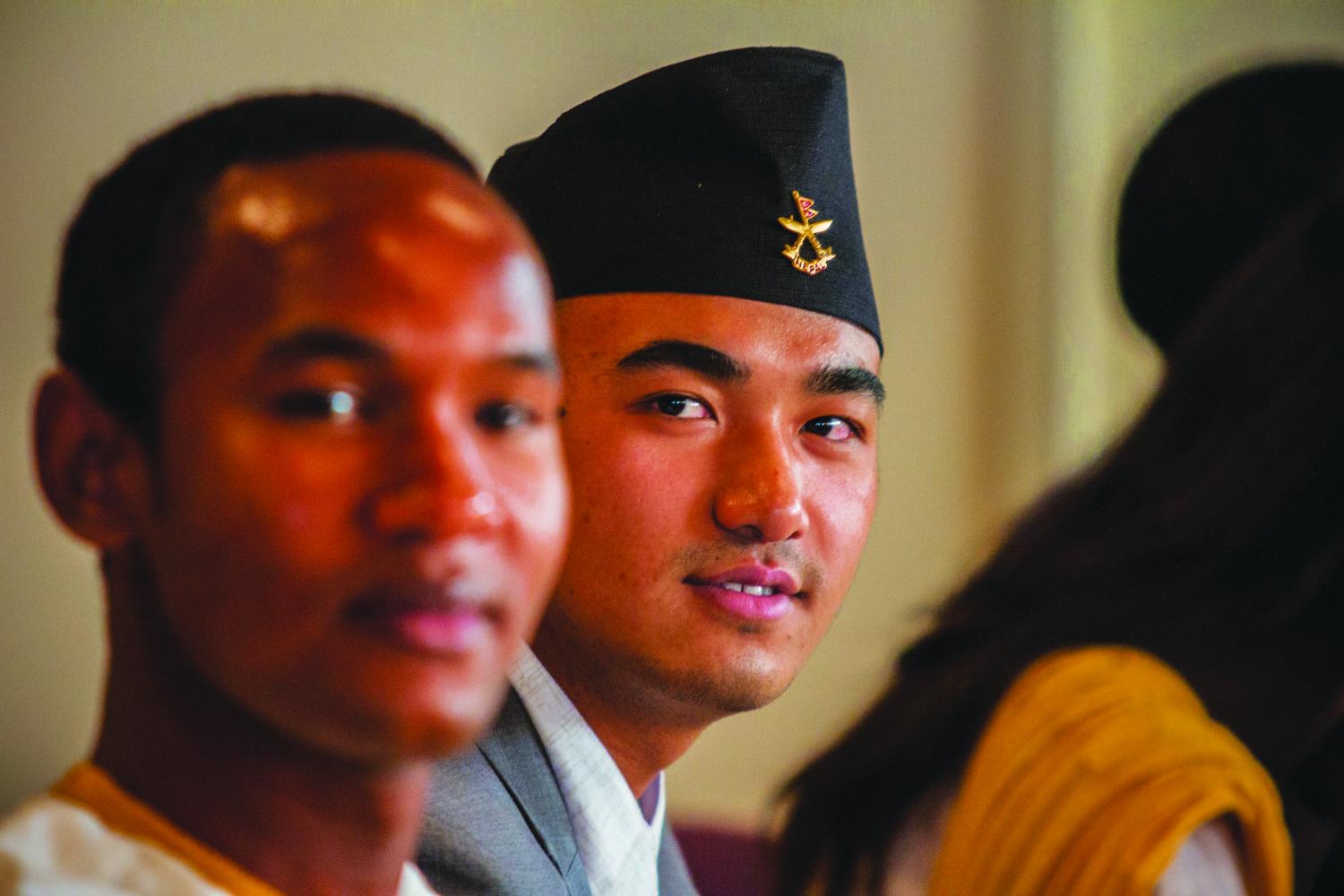 Left to right: Yukesh Mikchan (‘21) and Babba Laminou (‘21) listen to a speaker at the Diversity Center’s annual Student Welcome Dinner.