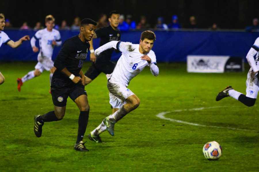 Bernardo+Marotti+%28%E2%80%9818%29+attempts+to+out+sprint+Loras+player+to+the+ball.