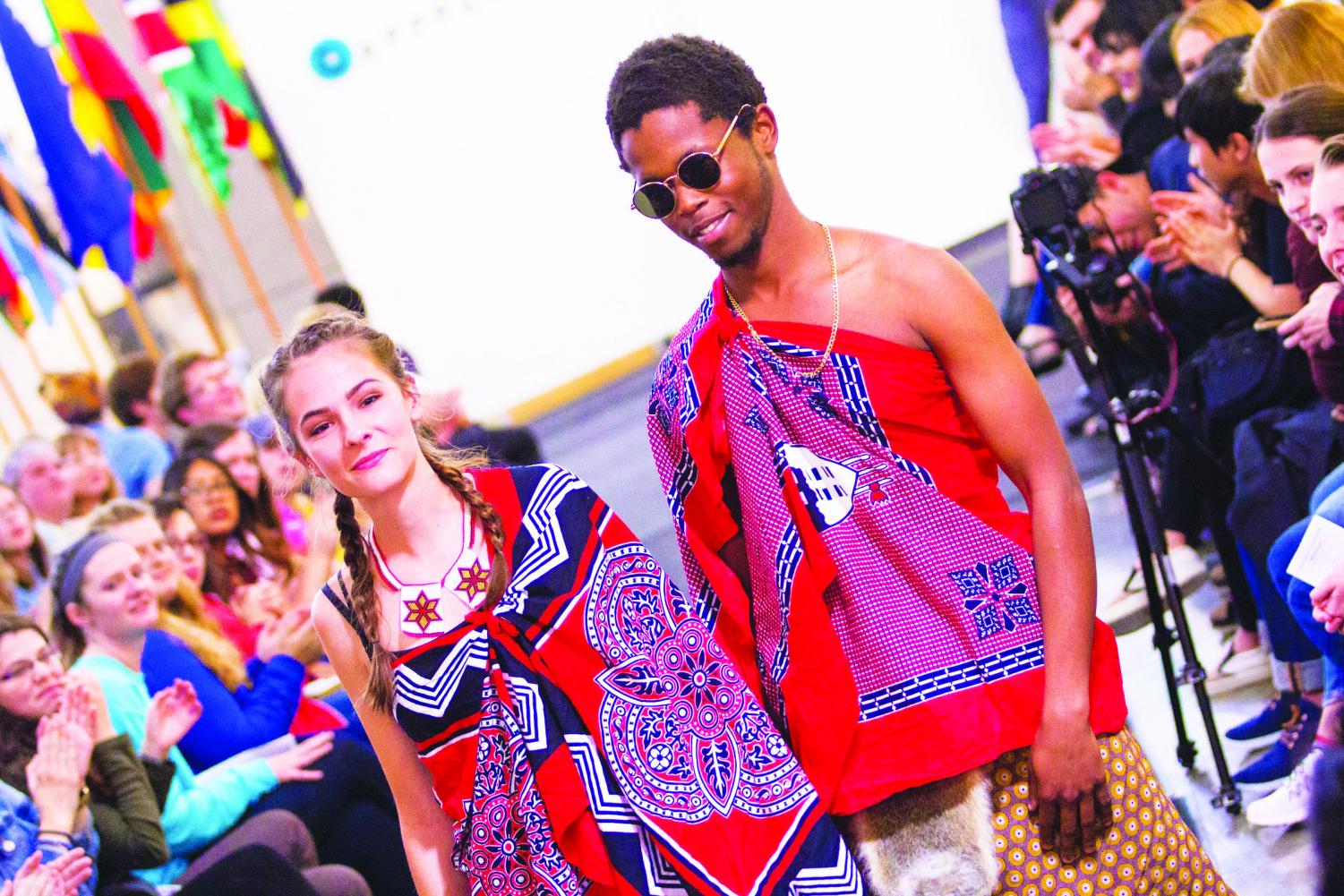 Lauren Knuckey (‘19) and Malu Mndzebele (‘21) in the 2017 International Fashion Show, demonstrating cultural appreciation. They are both wearing the traditional attire of Swaziland called ‘emahiya.’