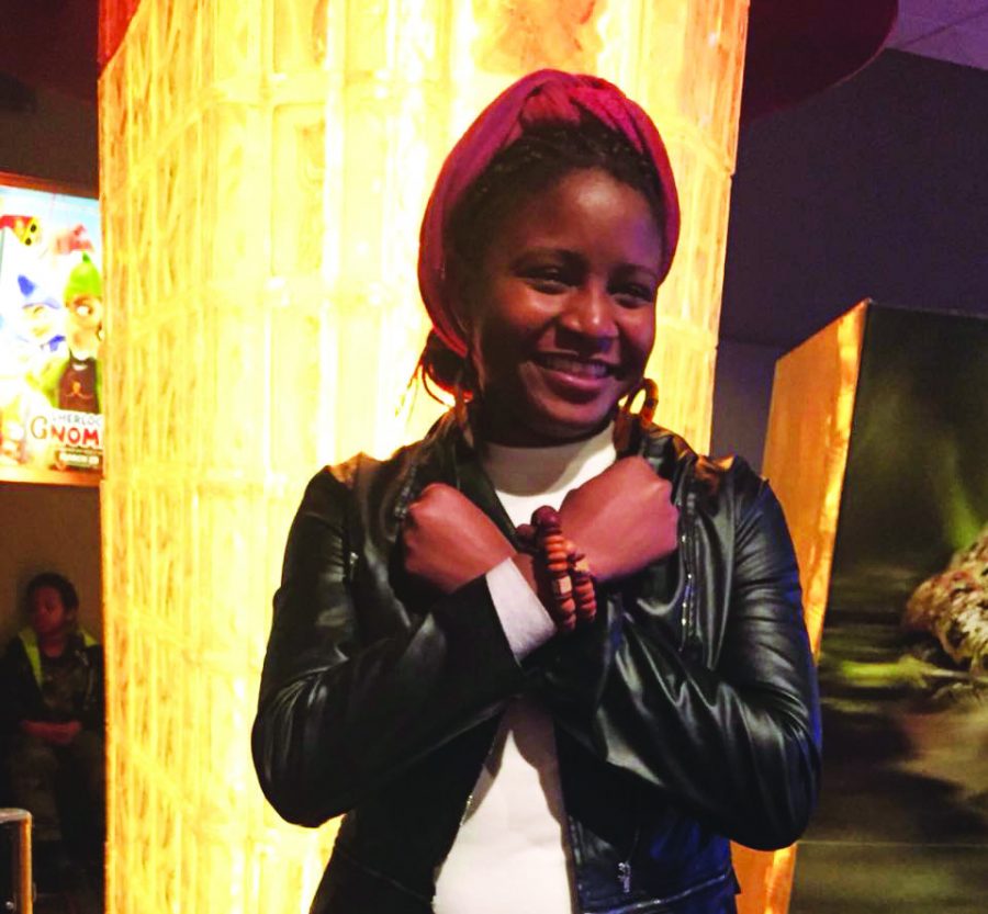 Tiwonge+Chirwa+%28%2719%29+demonstrates+the+Wakandan+greeting+as+depicted+in+the+movie+between+characters+T%27Challa+and+Shuri.