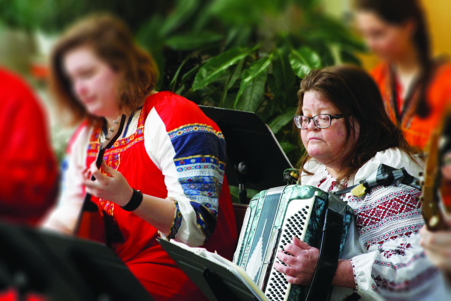 Full Professor of Russian Studies and founder of the Balalaika Ensemble Laurie Iudin-Nelson plays the accordian during the Balalaika Concert.