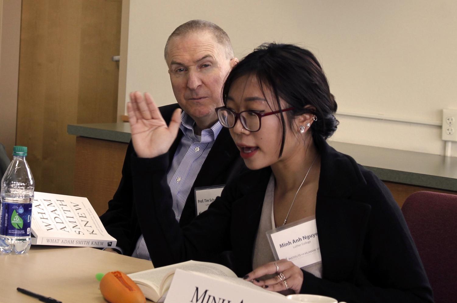 Minh Anh Nguyen ('20) and Professor of Management Tim Schweizer ('90) discuss market morality.