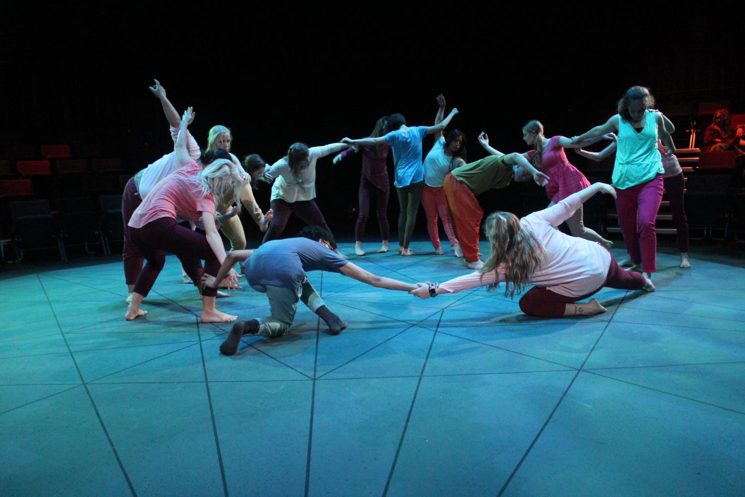 The performers in “Soil Turning” dance together in the final moments of the performance.