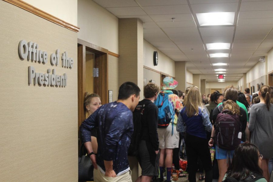 Students+gather+outside+the+office+of+the+president+during+the+sit-in.
