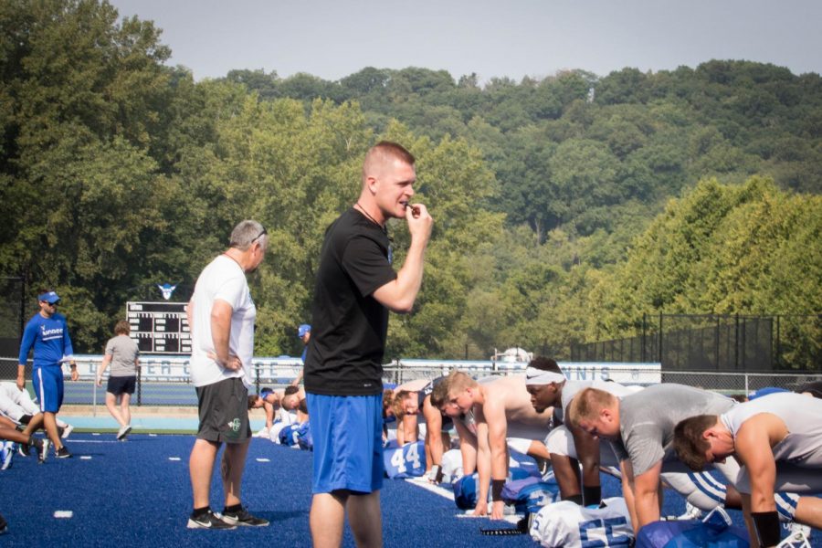 Director of Athletic Performance Jeff Jones coaches the Luther football team in conditioning. 