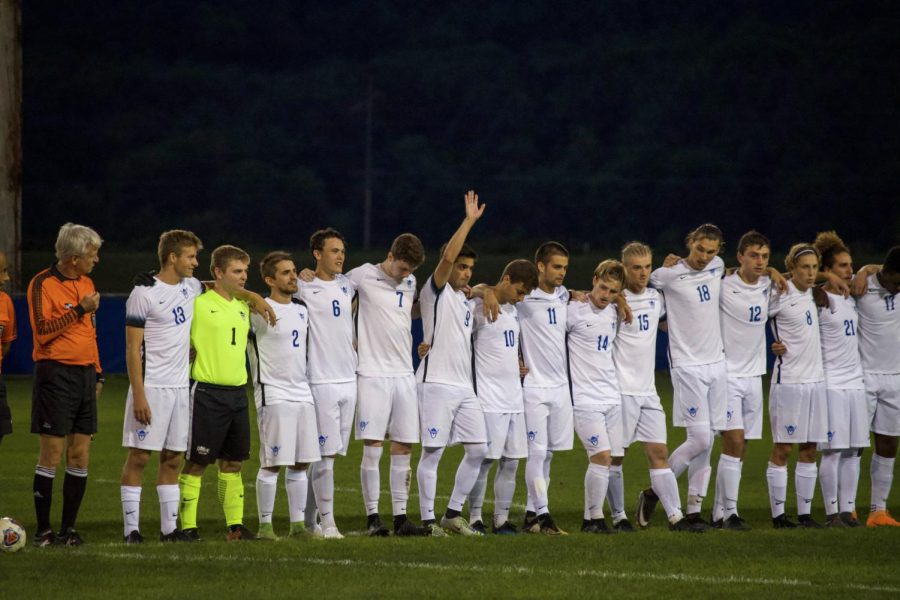 Luther Men’s Soccer Team members come together after a victory.