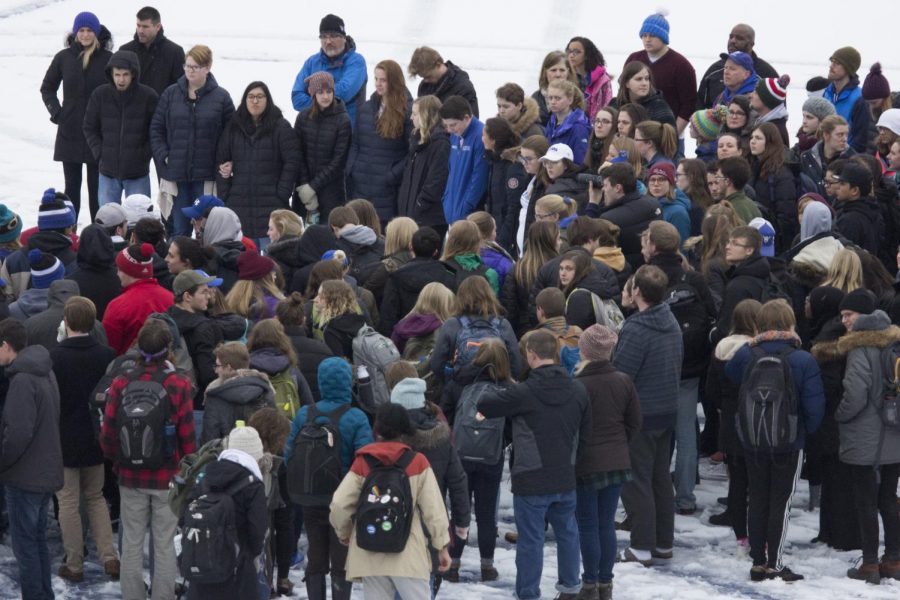 Students gather on the football field after the football field incident. 