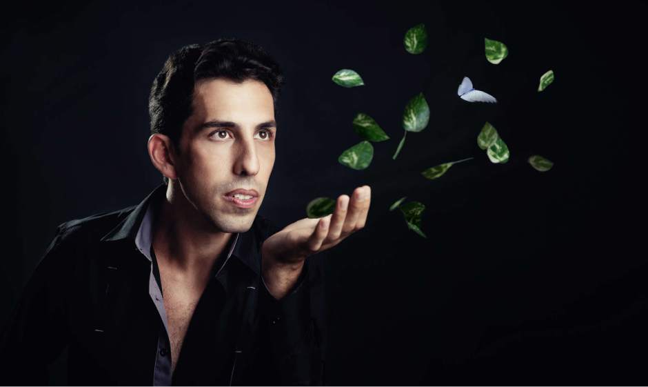 Vitaly uses images from the natural world, like leaves and butterflies, throughout his performance.