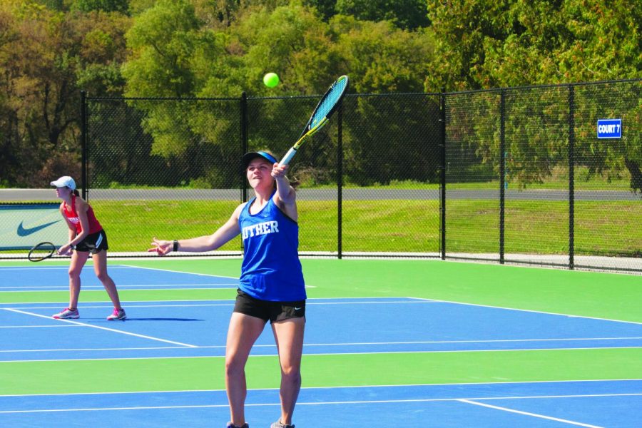 Stephanie Almquist (21) returns a hit against Coe.         	