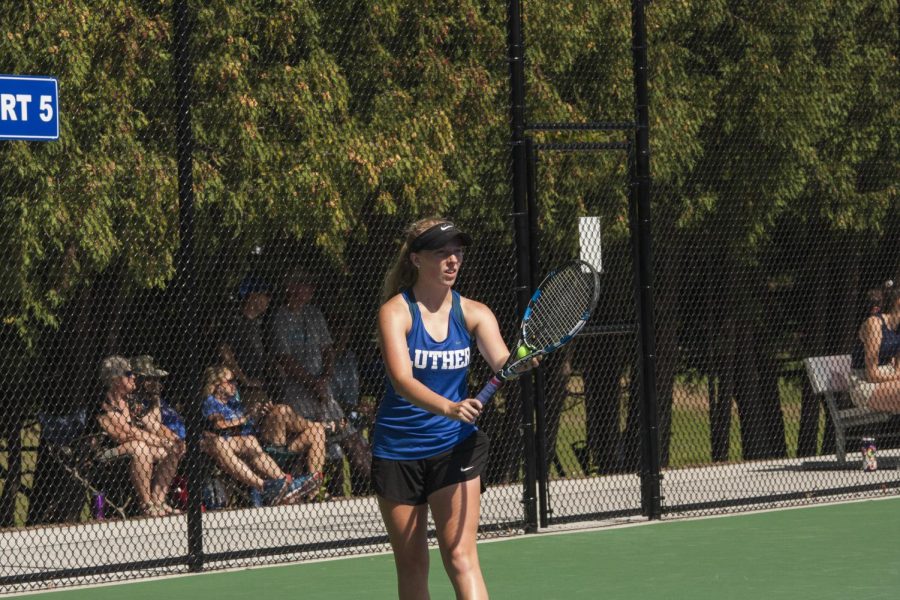 Megan Grimm (22) prepares to serve against Coe on Oct. 7. 