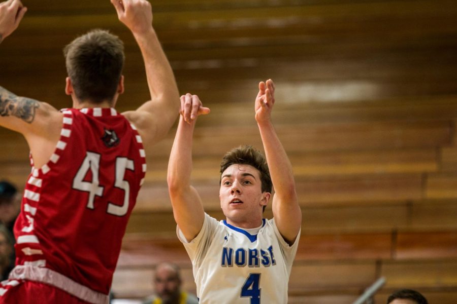 Anthony Westhusing (21) shoots the ball in Luthers win against Bethany Lutheran College. 