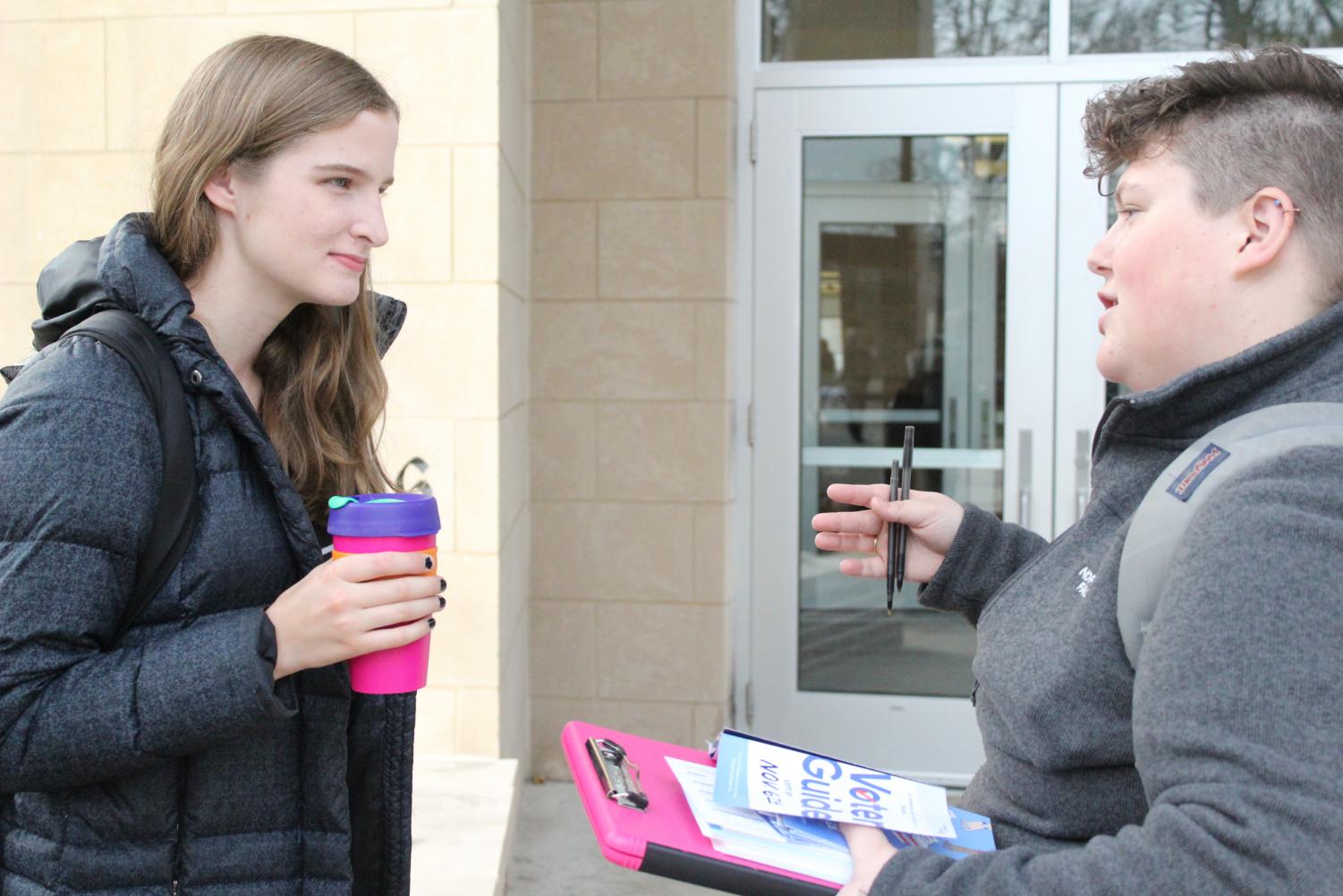 Laura Duffield (‘21) stopped to listen to Sarah Wyatt (‘20) provide information on the candidates.