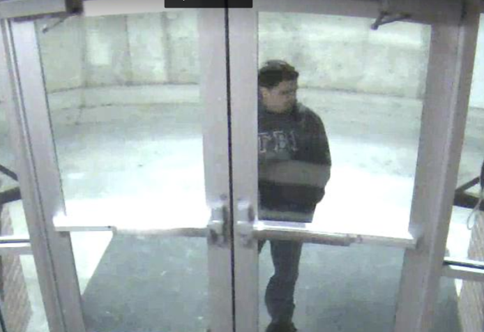 A+security+camera+at+Miller+Hall+captures+the+suspect+trying+to+enter+the+dorm.