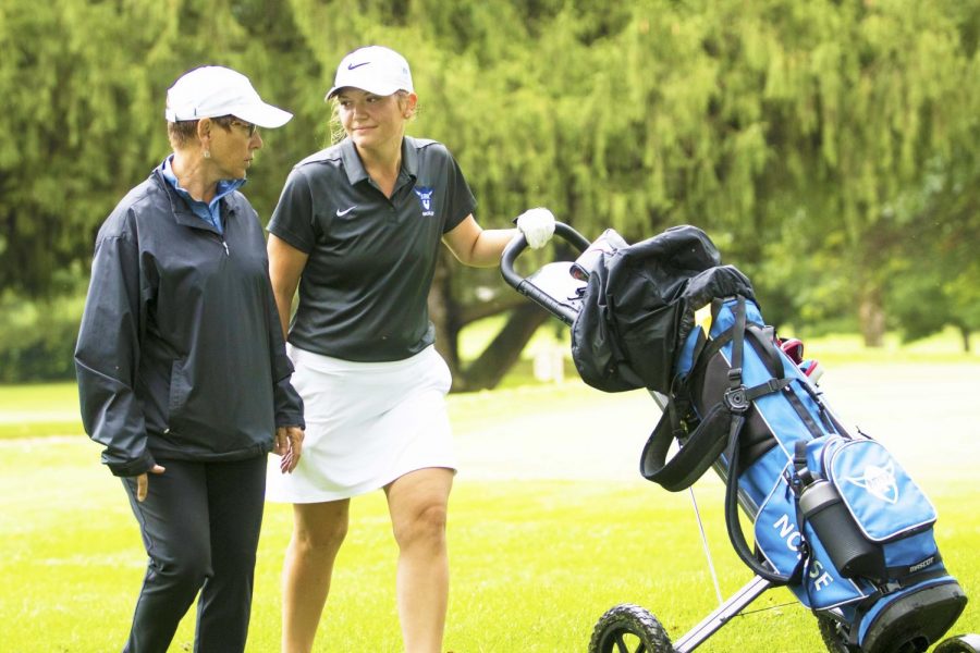 Interim Head Coach Jane Hildebrand (74) coaching Maddy Wedmore (22).