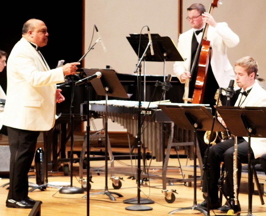 Guzmán conducts members of the Jazz Orchestra before a show