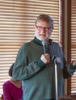 Charles Bentling presents as Luther faculty and staff listen. 