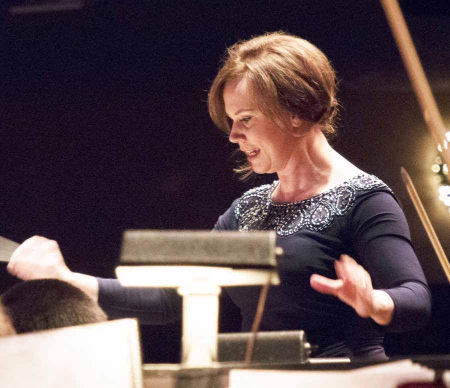 Associate Professor of Music Jennaya Robison (96) conducting during Christmas at Luther. 