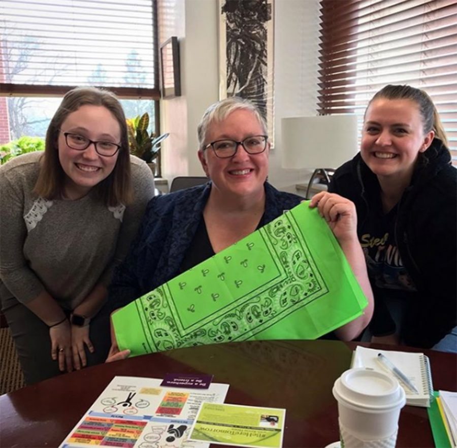 President Jenifer Ward helped Hannah Wollack ('20) (left) and Samantha Morgan ('20) (right) promote the project.