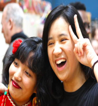 Anita Tamang (22) and Tam Ta (22) celebrate the Ethnic Arts Festival.