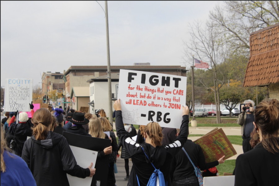 Protesters travel down Water Street to the Winneshiek County Courthouse, where several speakers and musicians were prepared to perform.