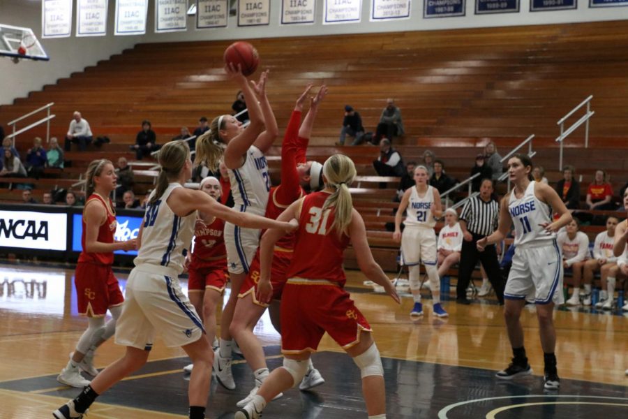 Kaci Jo Ames (21) goes up for a shot during a game last season against Simpson. Photo courtesy of Photo Bureau. 