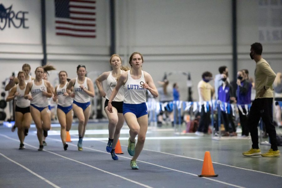 Gabrielle Janssen ('24) leads a pack of runners during Luther's Track and Field triangular against Loras and Coe.