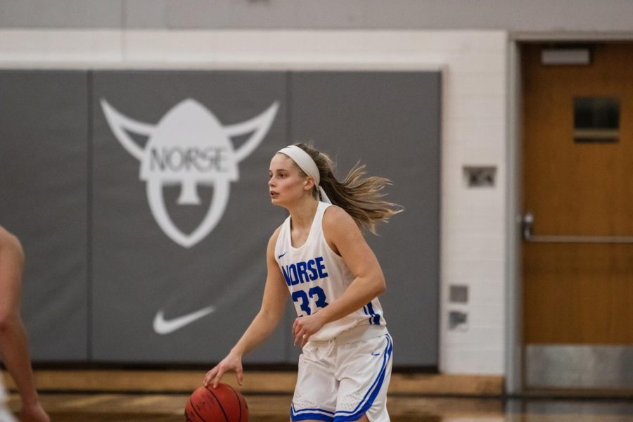 Kristen Elliot (‘22) dribbles the ball during a home game against Dubuque University on February 13.