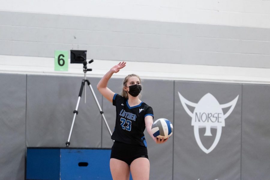 Defensive specialist Greta Stauffacher (‘23) serves during Luther’s match on March 3 against Loras.