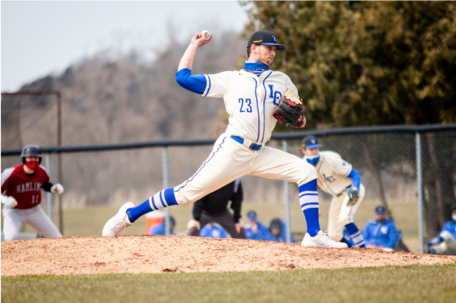 Luther pitcher Nick Dufoe (22) throws a pitch during the first of two games against Hamline on March 21. Dufoe pitched eight innings and only allowed one earned run.