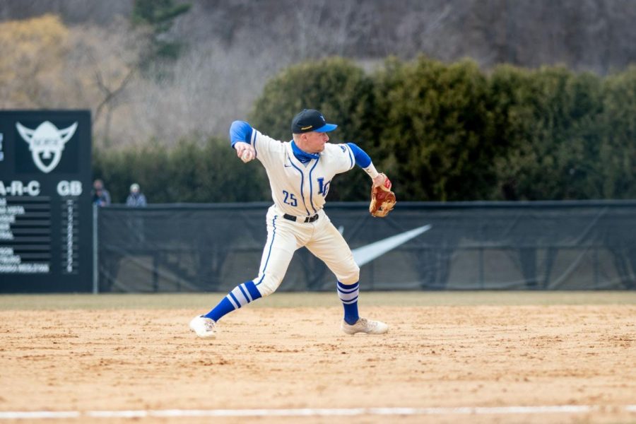 Kelby+Johnson+%28%E2%80%9821%29+throws+to+first+base+during+a+game+against+Hamline+University+on+March+21.