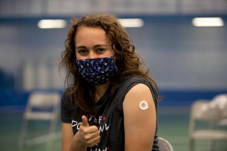 Brooke Stanga (22) poses after receiving her first COVID-19 vaccination at the on-campus Luther vaccination clinic. 