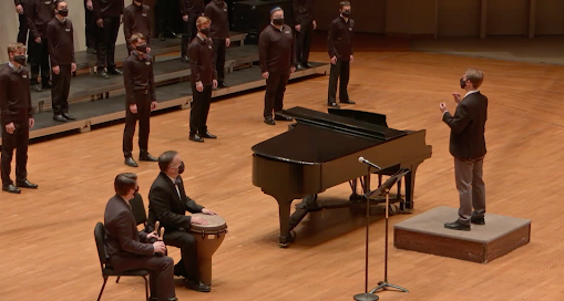 David Gorman ('21) conducts the Norskkor choir. Jackson Geadelmann ('23) | Chips