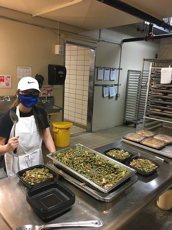 Aimme Rothschild (‘24) packages food for donation to the Decorah, IA area food pantries. (Photo courtesy of Luther College)