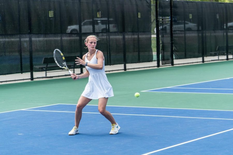  Devon Bourget (‘21) hits a forehand during the championship match against Wartburg. (Photo courtesy of Antony Hamer for Luther College Photo Bureau)