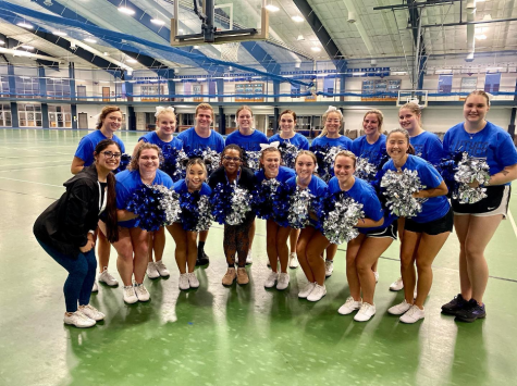
Dean of Student Engagement Ashley Benson poses with the Luther College cheerleading team after joining in on one of their practices. Photo courtesy of Luther College Cheer.
