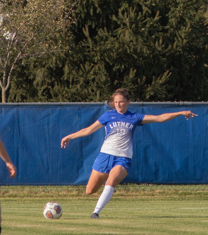  Luther defender Ella Smith (‘23) kicks the ball downfield during a game against the UW-La Crosse earlier this season.