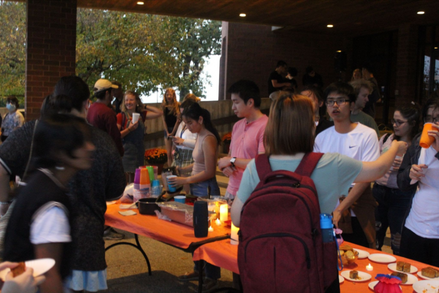 Students lining up for boba and mooncakes under the CFL awning. (Photo by Hallie Johnson 23)