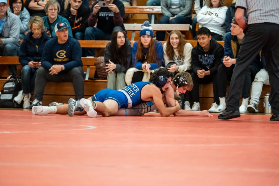 Caden Schrage (‘24) wrestles during the Luther Open on November 13. (Photo courtesy of Luther Photo Bureau
