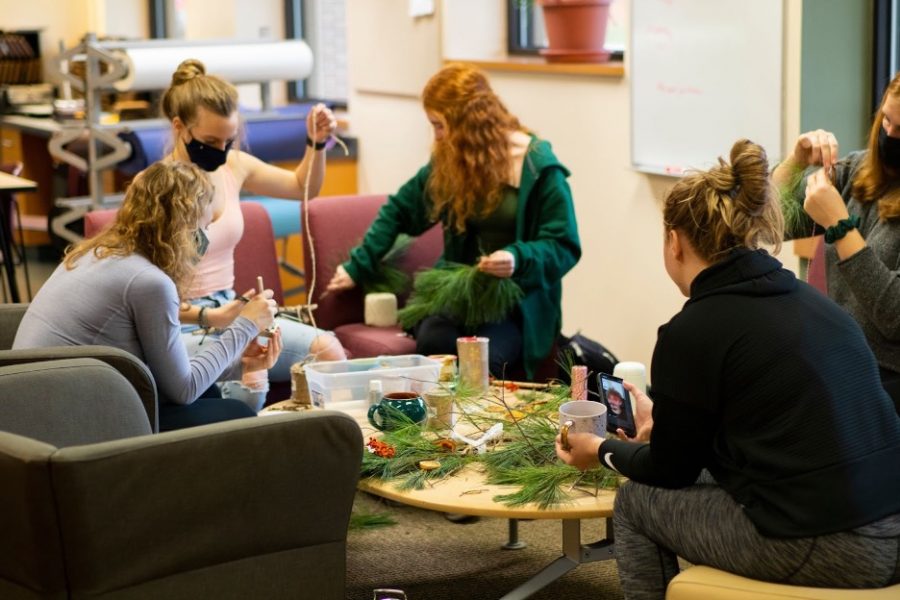 Luther students wrapping gifts with sustainable materials.                                                                         Photo courtesy of Duy Nguyen (‘25)
