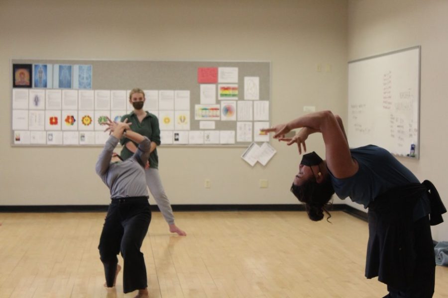 Kealoha Ferreira (left) and Alexandra Eady (right) demonstrating the Ananya energy sequence.