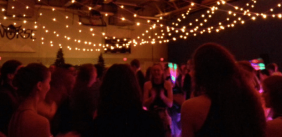 Students socialize in the Regents main gym at Spring Fling.                                        Norah Austin ('25) |Chips