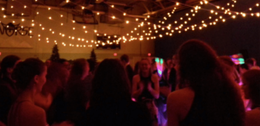 Students socialize in the Regents main gym at Spring Fling.                                        Norah Austin (25) |Chips