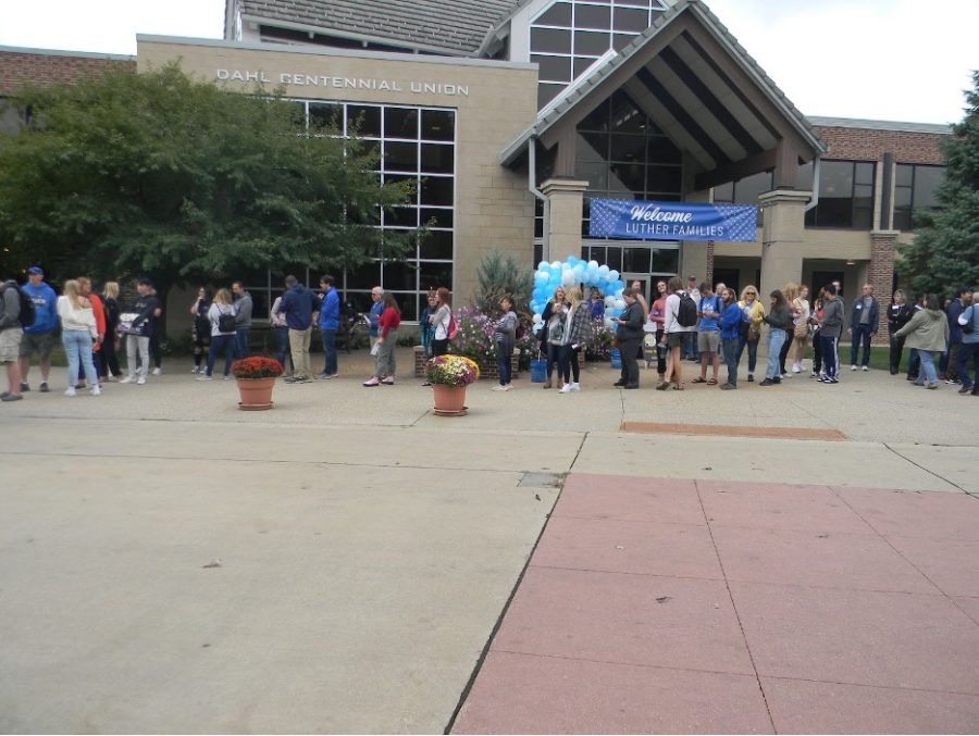 A line of community members wait to buy lunch from food trucks. Photo by Serenity Figueroa
