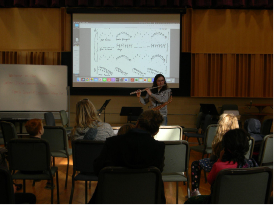 Emily Fisher (‘23) plays the flute for a captivated crowd at Luther College Community Music School’s Young Person’s Concert October 29. Photo courtesy of Serenity Figueroa (‘23). 