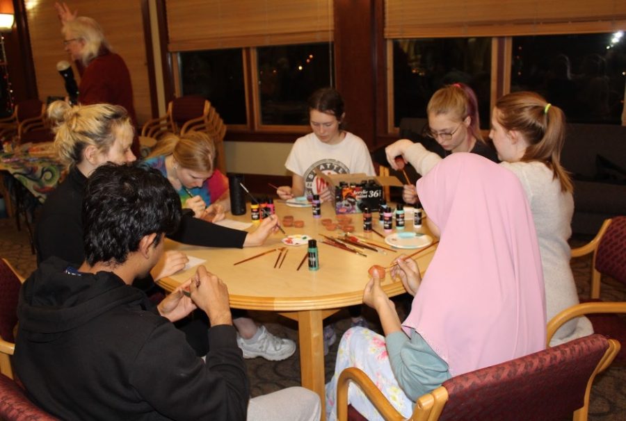 

Students painting Diya during the Diwali celebration. Photo Courtesy of Korpo M. Selay